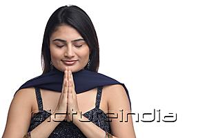 PictureIndia - Woman with hands together, eyes closed
