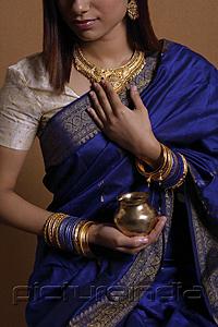 PictureIndia - Indian woman wearing sari and holding offering