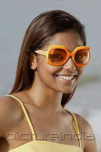 PictureIndia - Portrait of woman with sunglasses, smiling