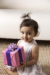 PictureIndia - toddler holding a present