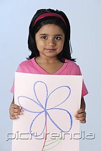 PictureIndia - Little girl holding picture of flower
