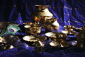 PictureIndia - Still life of Indian brass bowls and cups on table