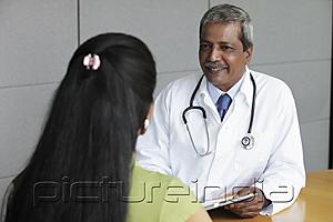 PictureIndia - Indian doctor talking to female patient