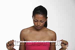PictureIndia - woman looking down at tape measure