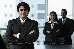 PictureIndia - Indian business man standing in front of colleagues