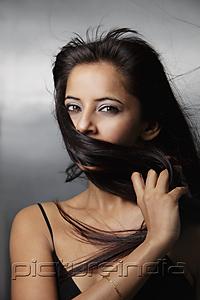 PictureIndia - head shot of woman with hair in front of her face