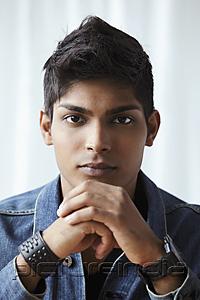 PictureIndia - head shot of young man looking at camera