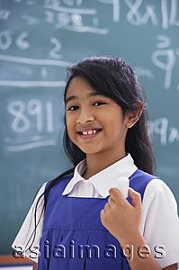 Asia Images Group - girl with chalk in hand smiling