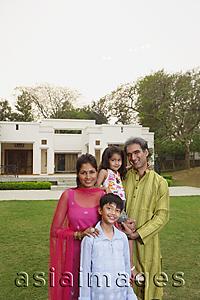 Asia Images Group - family in front of home