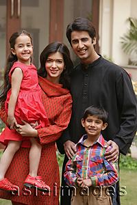Asia Images Group - family of four outdoor portrait, smiling at camera