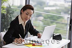 Asia Images Group - businesswoman at laptop