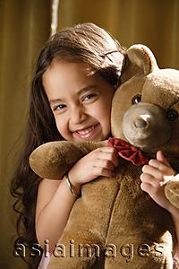 Asia Images Group - little girl hugging teddy bear