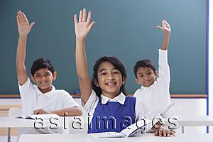 Asia Images Group - three students with raised hands