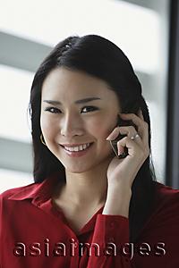 Asia Images Group - woman on cell phone, smiling