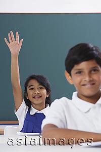 Asia Images Group - two students, girl raises hand