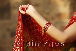 Asia Images Group - woman's arm wearing bangles