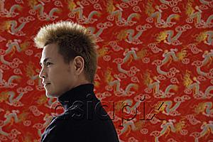AsiaPix - Profile of smiling man, Chinese silk backdrop