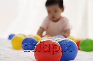 AsiaPix - baby girl playing with balls