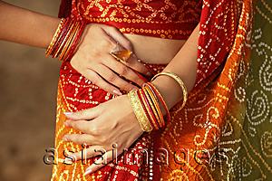 Asia Images Group - arms of woman wearing bangles