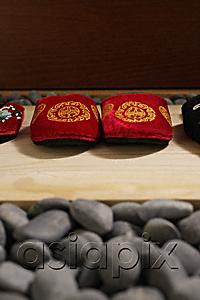 AsiaPix - front view of red oriental slippers at door front