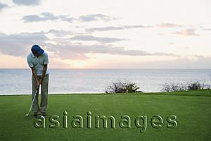 Asia Images Group - man ready to hit golf ball