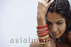 Asia Images Group - young woman wearing many bangles