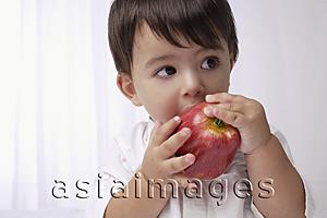 Asia Images Group - baby boy eating apple