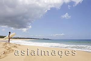 Asia Images Group - man standing on beach, looking at waves