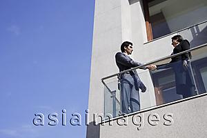 Asia Images Group - business associates shaking hands