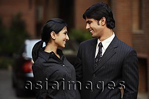 Asia Images Group - couple standing in front of car