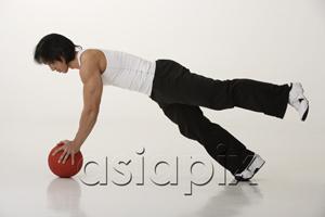 AsiaPix - Chinese man working with medicine ball