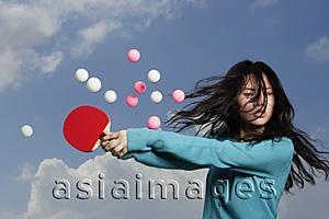 Asia Images Group - lady hitting ping pong balls