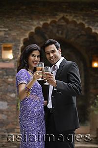 Asia Images Group - young couple with glasses of wine