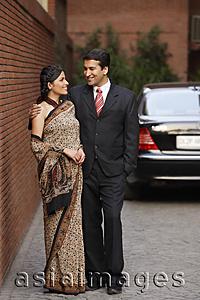 Asia Images Group - couple in front of car, woman in sari
