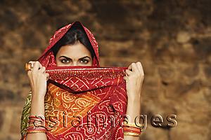 Asia Images Group - woman with sari covering face