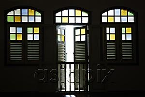 AsiaPix - Light coming through old shop house stained glass windows.