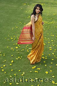 Asia Images Group - young woman in yellow sari