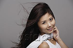 AsiaPix - Chinese woman wearing white, hair blowing