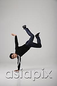 AsiaPix - Man break dancing on floor