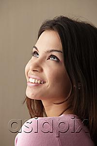 AsiaPix - head shot of young woman looking up and smiling