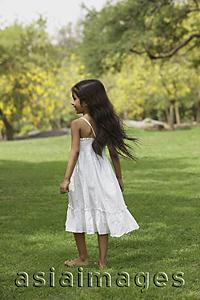 Asia Images Group - Little girl in park wearing white