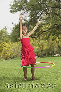 Asia Images Group - little girl with hula hoop