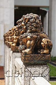 AsiaPix - Row of bronze lions in front of temple