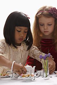 AsiaPix - two young girls having a tea party