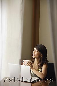 Asia Images Group - woman with laptop, cup of coffee