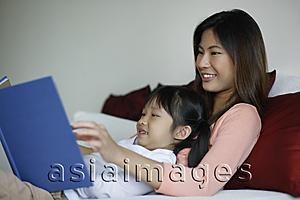 Asia Images Group - Mother and daughter reading a book