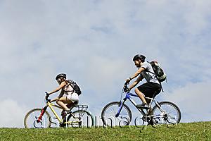 Asia Images Group - Two people on bicycles