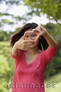 Asia Images Group - Woman making hand gesture