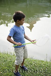Asia Images Group - Boy with butterfly net