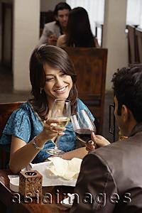 Asia Images Group - couple enjoying meal and drinks